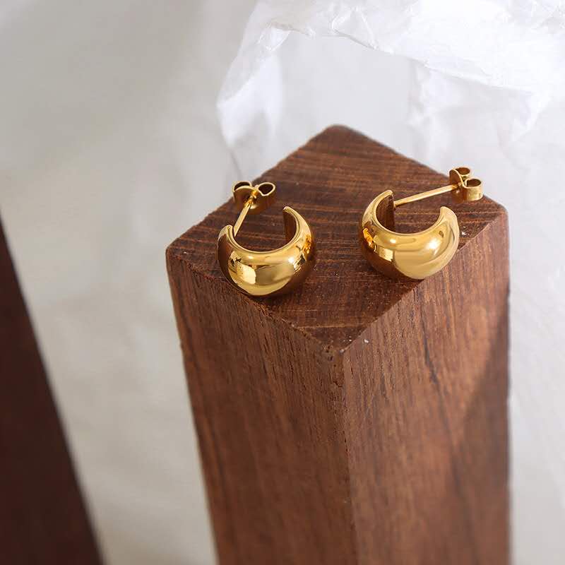 Boucles d'oreilles à arc audacieux